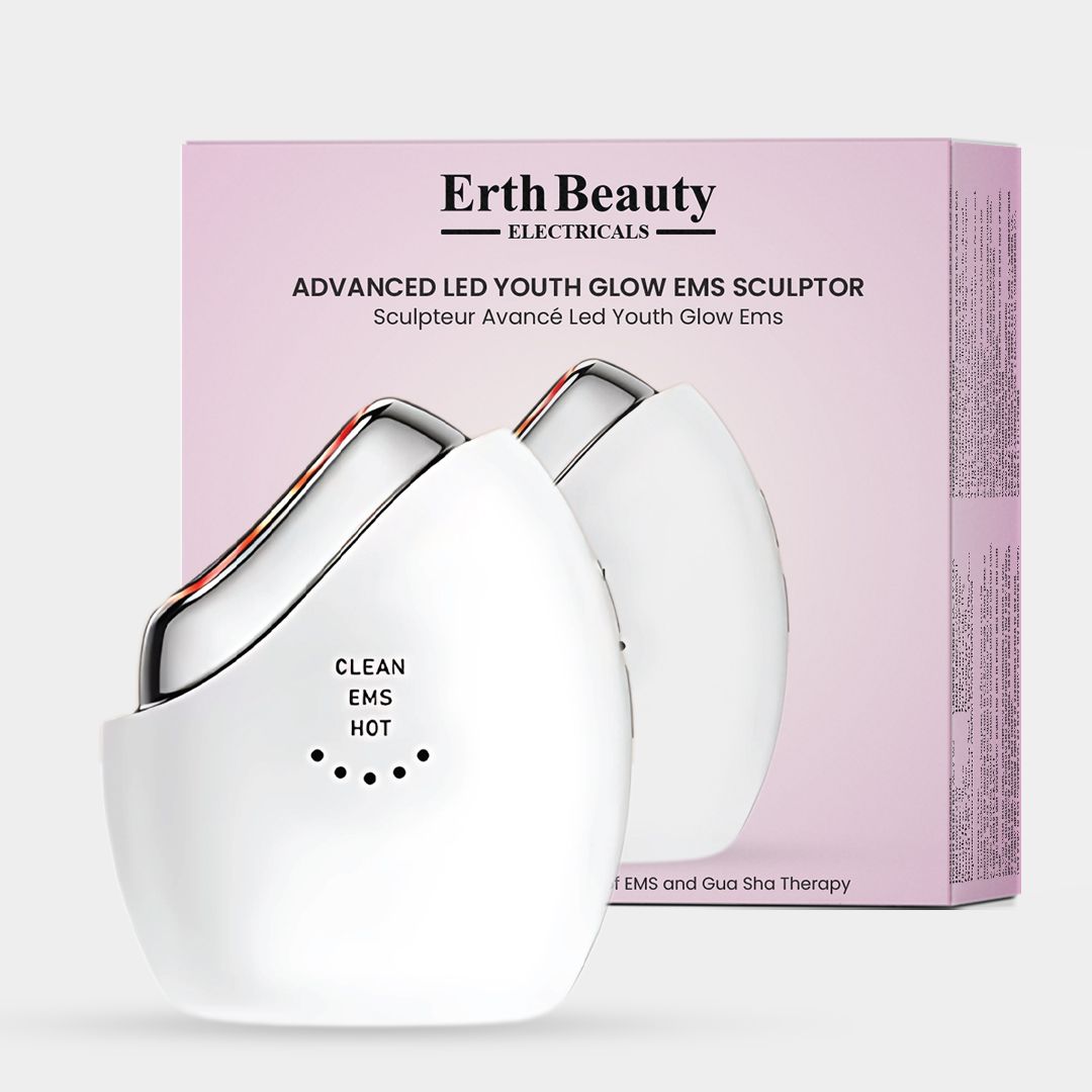 Weißes, ovales Gerät mit silberner Oberfläche und rosa Verpackung. Beschriftung: Erth Beauty, Advanced LED Youth Glow EMS Sculptor.