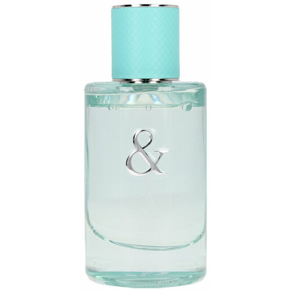 Rechteckige Glasflasche mit türkisfarbenem Deckel. Silbernes & Zeichen auf der Flasche. Klarer Inhalt.