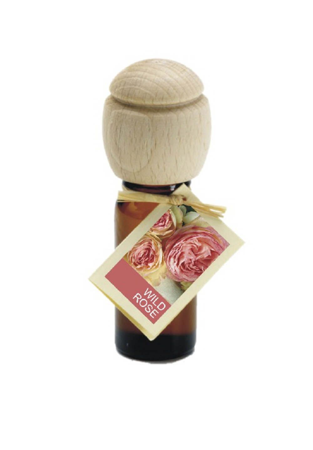 Braune Glasflasche mit Holzverschluss und Anhänger. Auf dem Anhänger steht "Wild Rose" und zeigt Rosen.