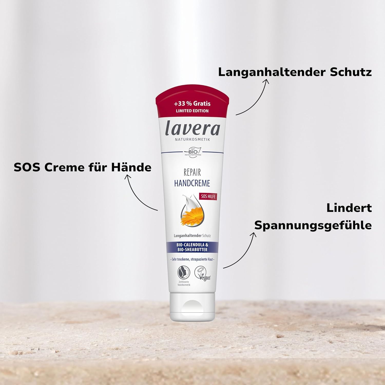 Weiße Tube lavera Repair Handcreme. Text: SOS Creme für Hände, Lang anhaltender Schutz, Lindert Spannungsgefühle. Vegan.