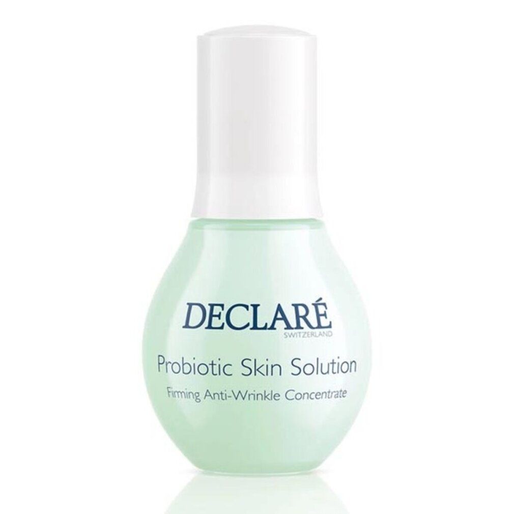 Grüne Flasche mit weißem Deckel. Aufschrift: DECLARÉ SWITZERLAND, Probiotic Skin Solution, Firming Anti-Wrinkle Concentrate.