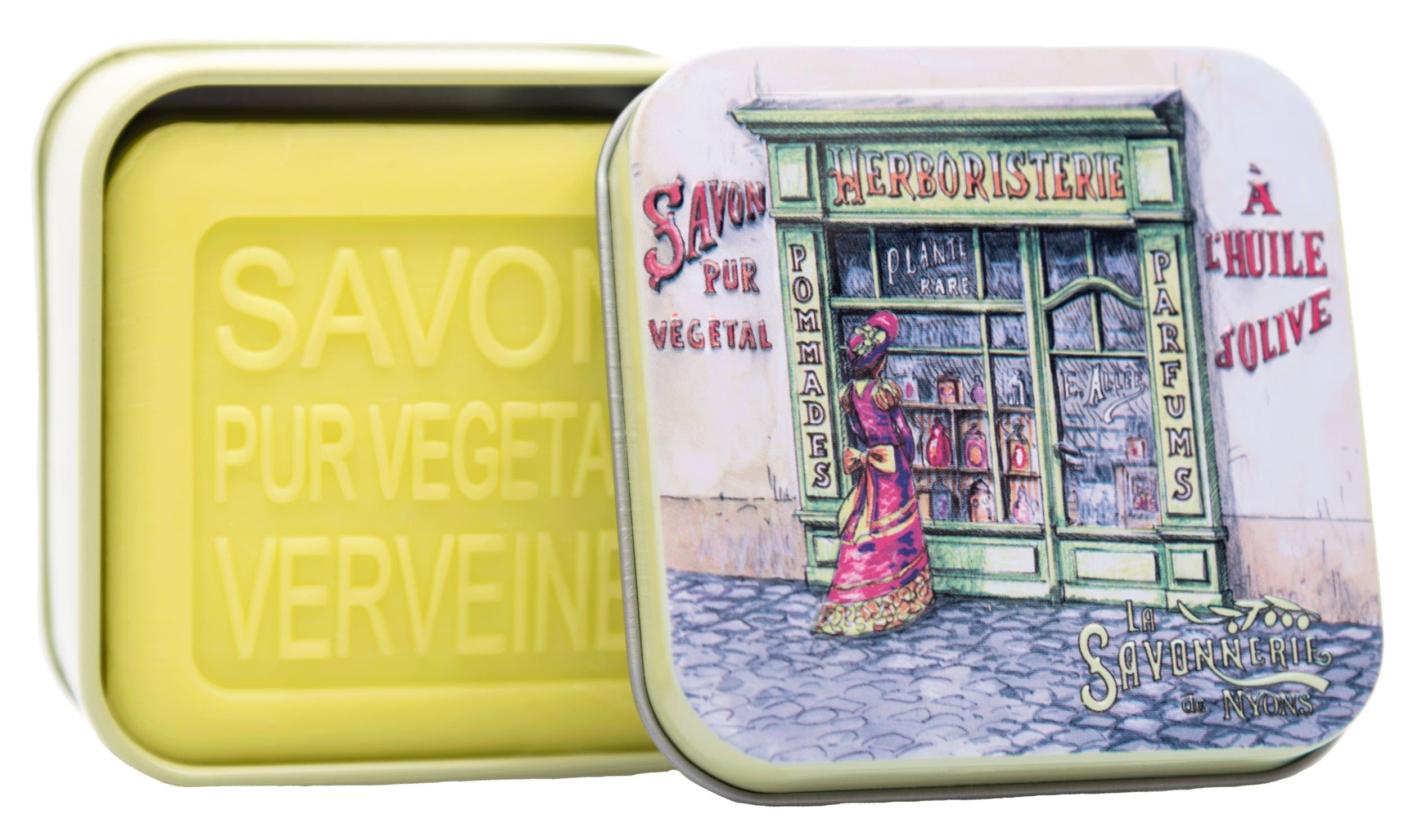 Geöffnete Metallbox mit Seife und Illustration einer Kräuterhandlung. Aufschrift: La Savonnerie de Nyons. Seife mit Prägung.