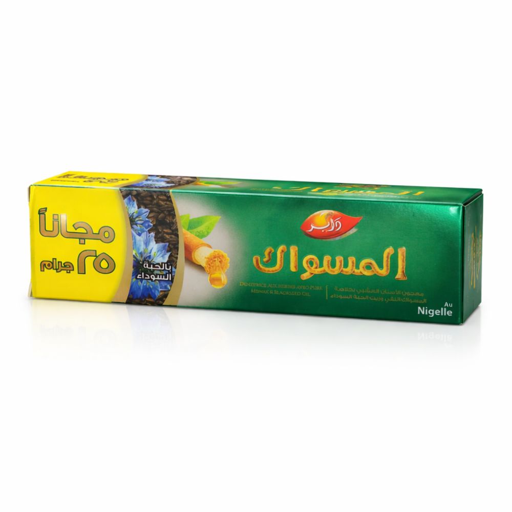 Verpackung, grün-gelb, mit arabischer Schrift. Aufschrift: Miswak. Mit Schwarzkümmelöl. Kostenlose 25g.