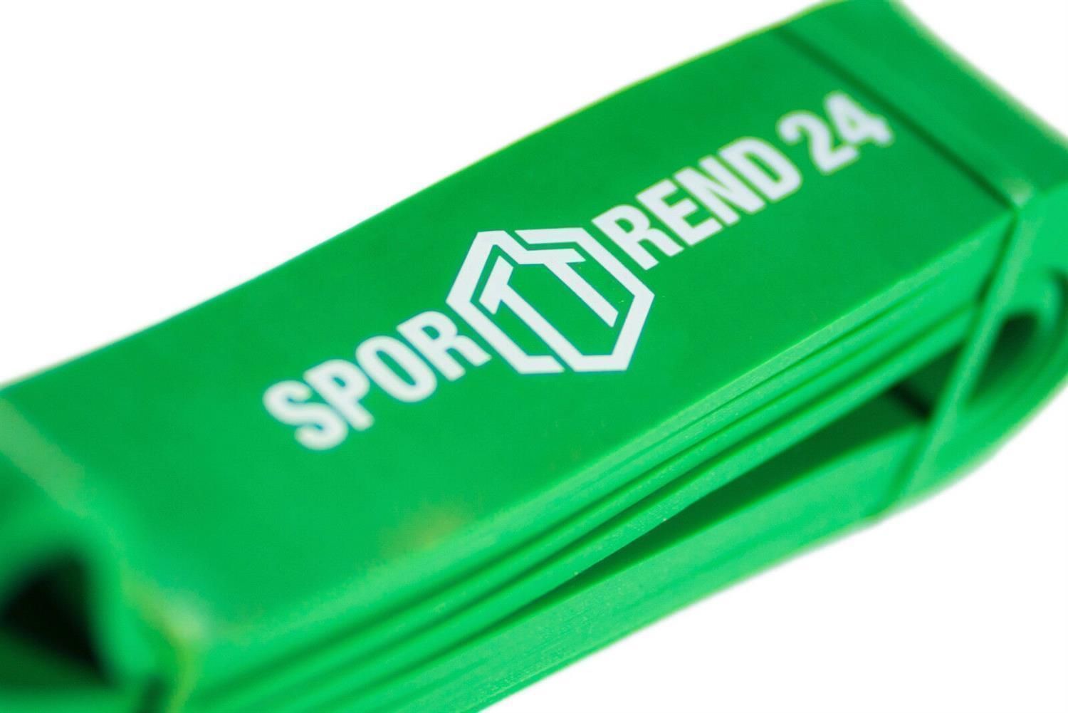 Nahaufnahme eines grünen Fitnessbands mit weißem "SPORTTREND 24" Logo. Band ist gefaltet.