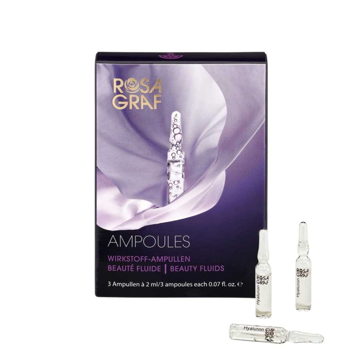 Verpackung mit Ampullen. Aufschrift: Rosa Graf, Ampullen, Wirkstoff-Ampullen, Beauty Fluids. Drei Ampullen liegen daneben.
