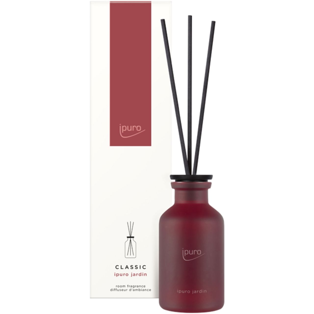 Raumduft-Diffusor mit Stäbchen und Verpackung. Rote Flasche mit schwarzem Deckel und Stäbchen. Verpackung mit rotem Streifen und Logo.