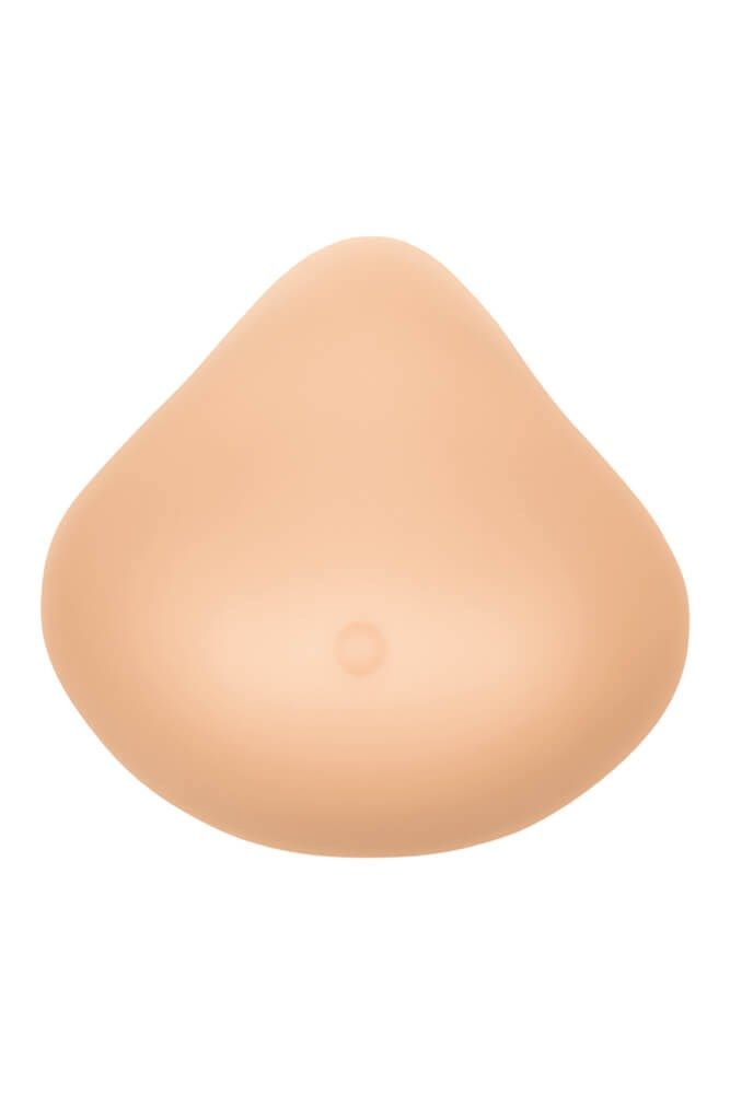 Brustprothese in Hautfarbe. Tropfenförmig, mit einer kleinen Vertiefung. Glatte Oberfläche.