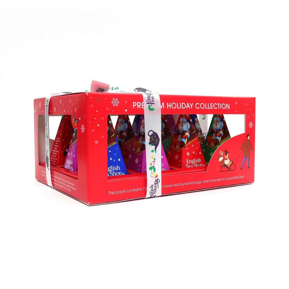 Rote Geschenkbox mit Teebeuteln. Aufdruck: English Tea Shop, Premium Holiday Collection. Mit Schleife. Sichtfenster.