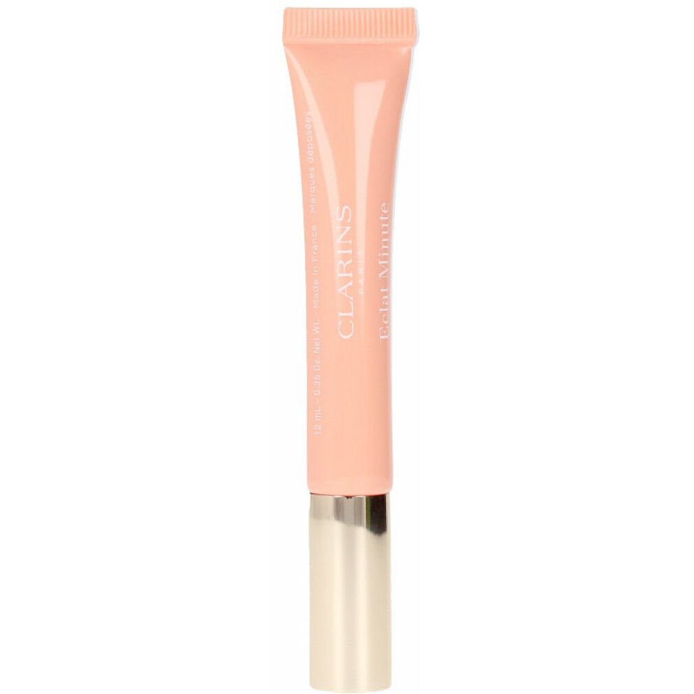 Clarins Natural Lip Perfector #02 Apricot Shimmer. Tube mit apricotfarbenem Inhalt und goldenem Verschluss. Schriftzug Clarins.