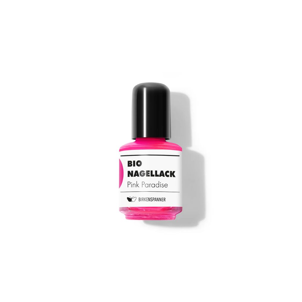 Nagellackflasche, pink. Schwarzer Deckel. Etikett mit "BIO Nagellack Pink Paradise" und Logo.