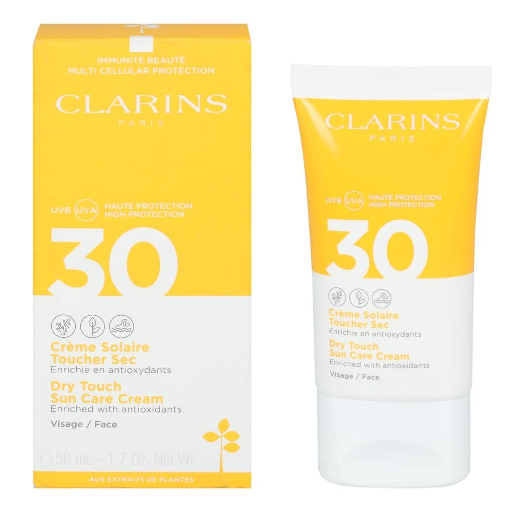 Clarins Crème Solaire Visage UVA/UVB 30. Gelbe Schachtel und Tube. Text: 30, Crème Solaire, Dry Touch, Visage/Face, 50 ml.