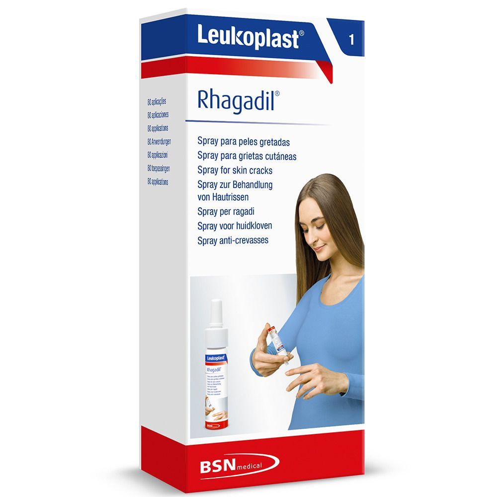 Leukoplast Rhagadil Spray in Verpackung. Weiße Flasche und Frau mit blauem Oberteil. Produktname sichtbar.
