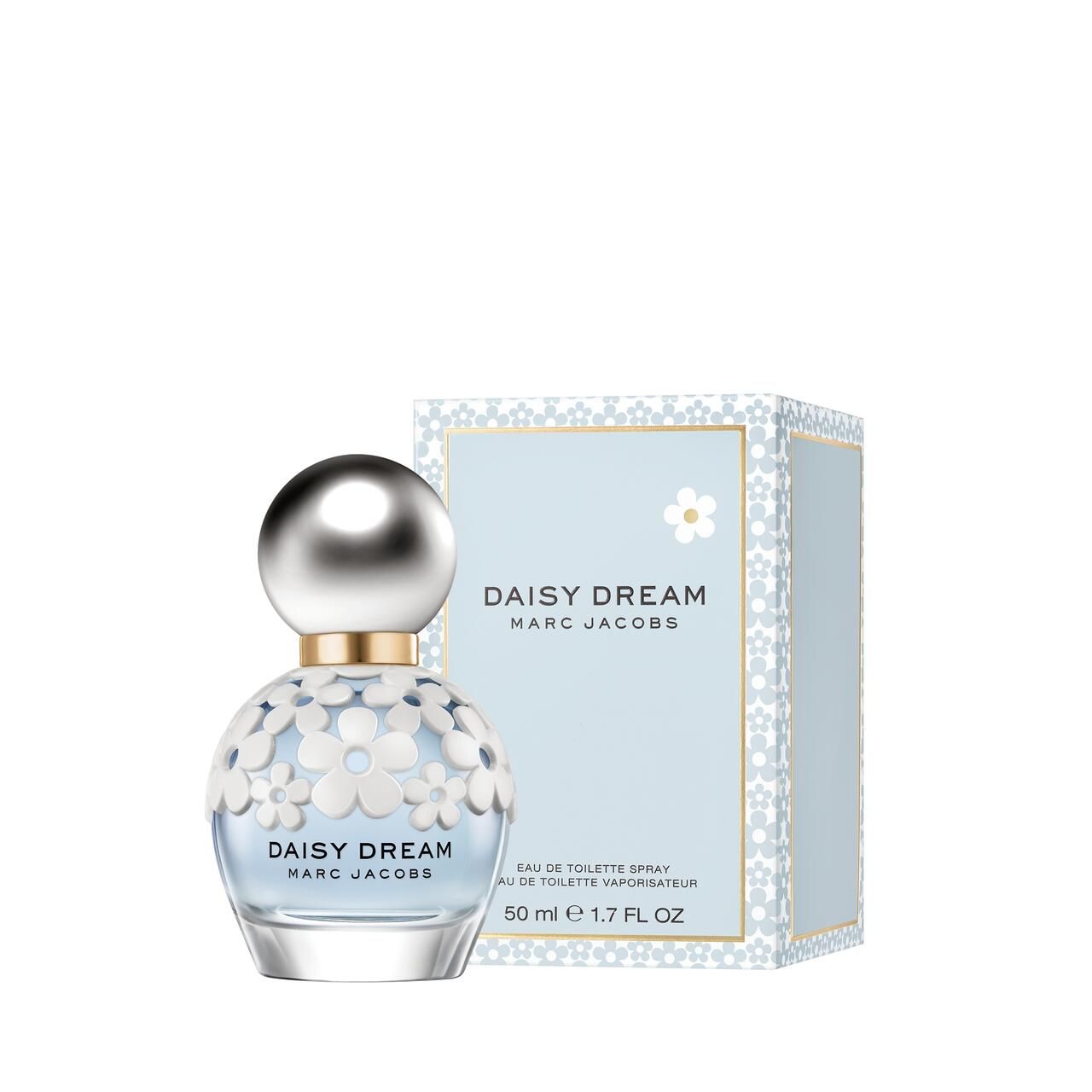 Parfümflasche und Schachtel. Flasche mit silbernem Deckel und weißen Blüten. Aufschrift: Daisy Dream, Marc Jacobs.