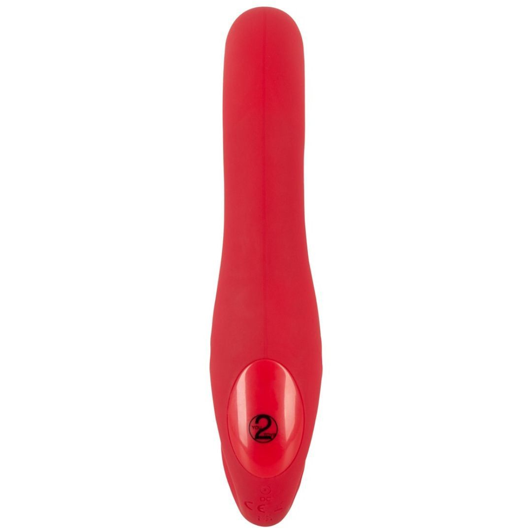 Roter Vibrator mit abgerundeten Enden. Auf der Oberfläche ist eine Taste mit der Zahl 2 zu sehen.