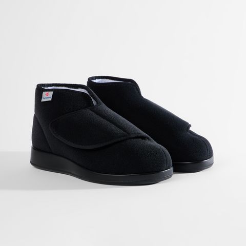 Schwarze Sandalen mit Klettverschluss und weißem Futter.