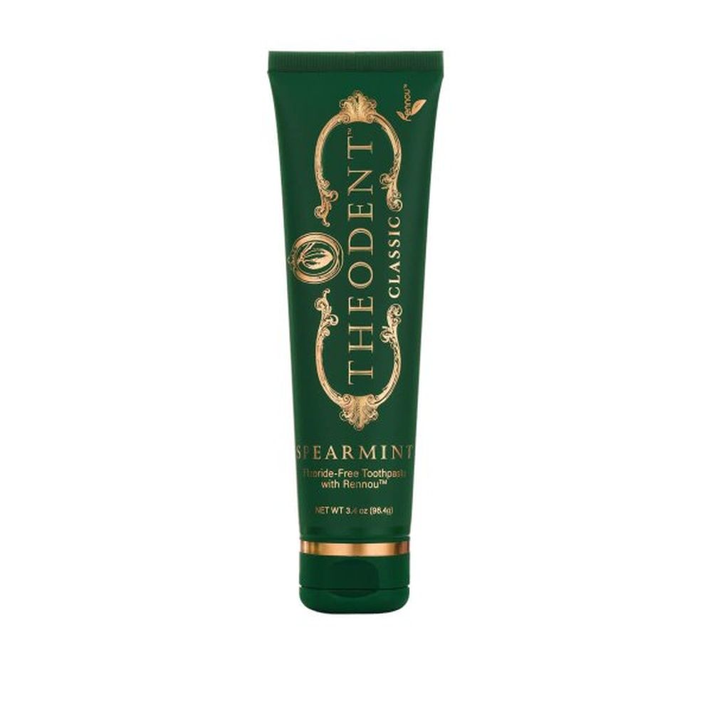 Grüne Tube mit goldfarbenem Aufdruck. Text: Theodent Classic Spearmint, fluoridfreie Zahnpasta. Nettogewicht 3 oz (85g).