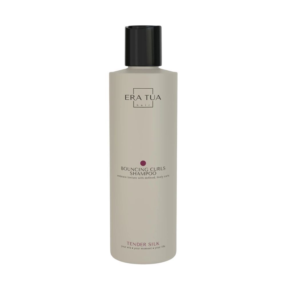 Flasche "Era Tua" Tender Silk Shampoo. Schwarzer Deckel, graue Flasche. Text: Bouncing Curls Shampoo. Vegan-Siegel.