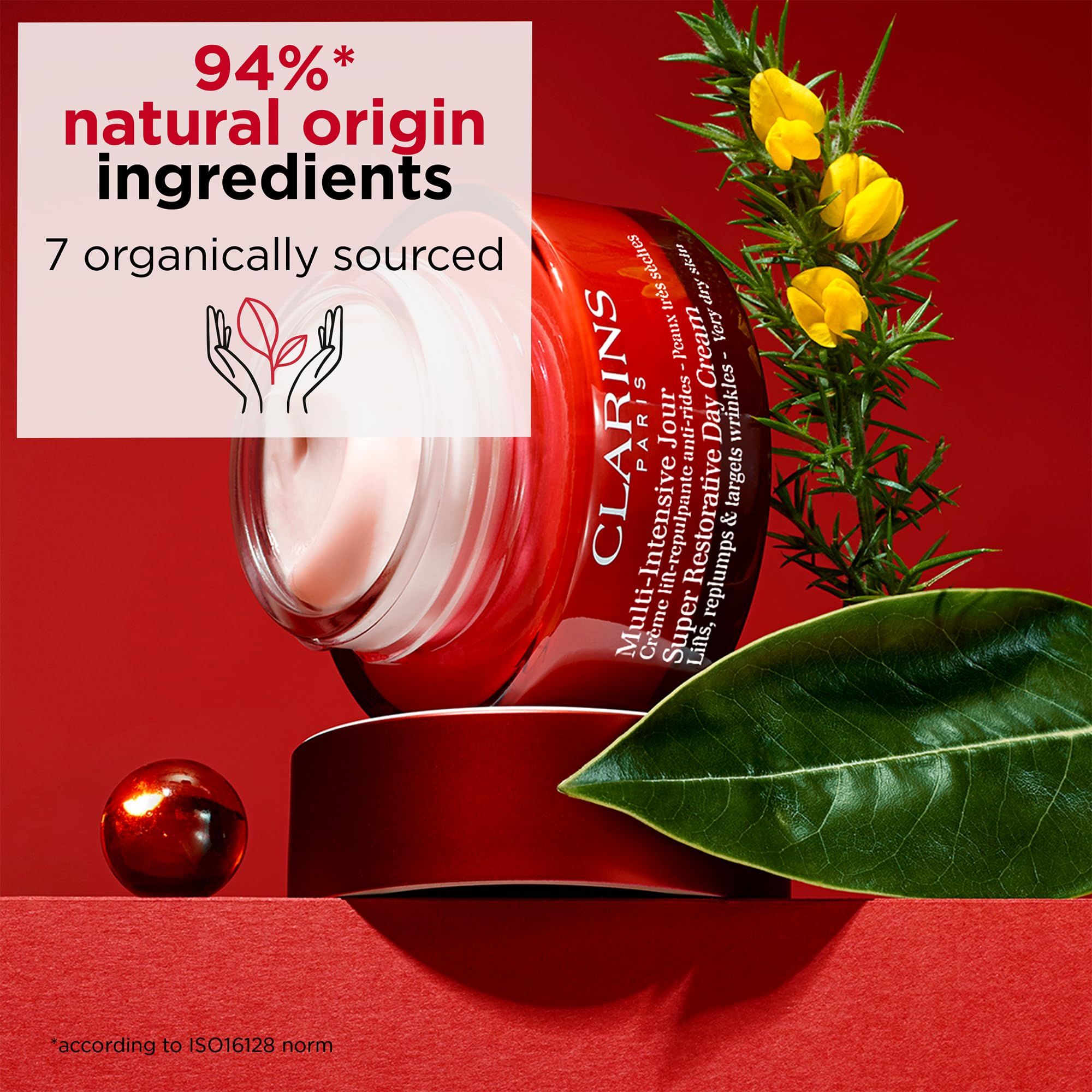 Roter Tiegel mit Creme. Text: Clarins, Multi-Intensive Jour, Super Restorative Day Cream.