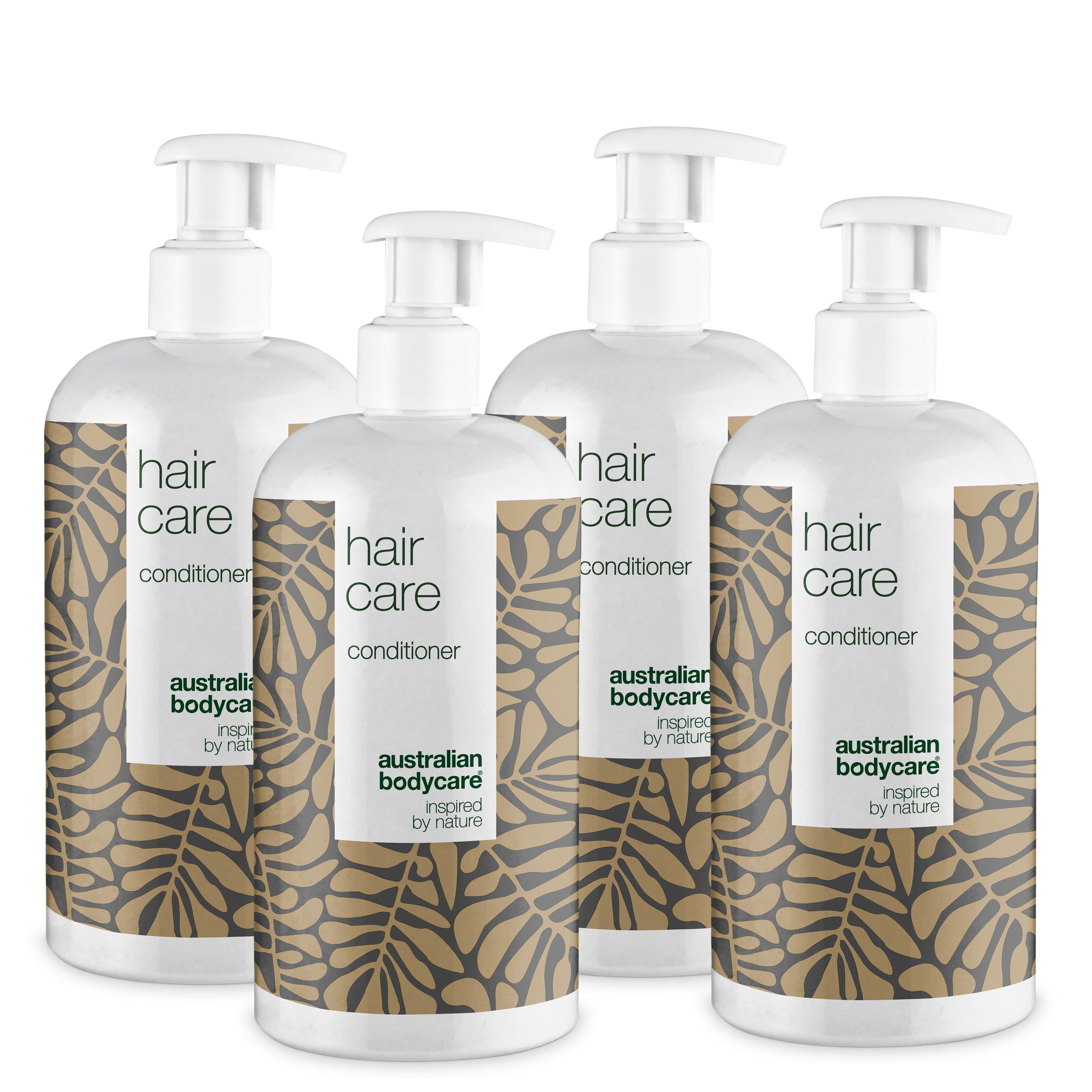 Vier Flaschen Conditioner mit Pumpverschluss. Aufschrift: Hair Care, australian bodycare.