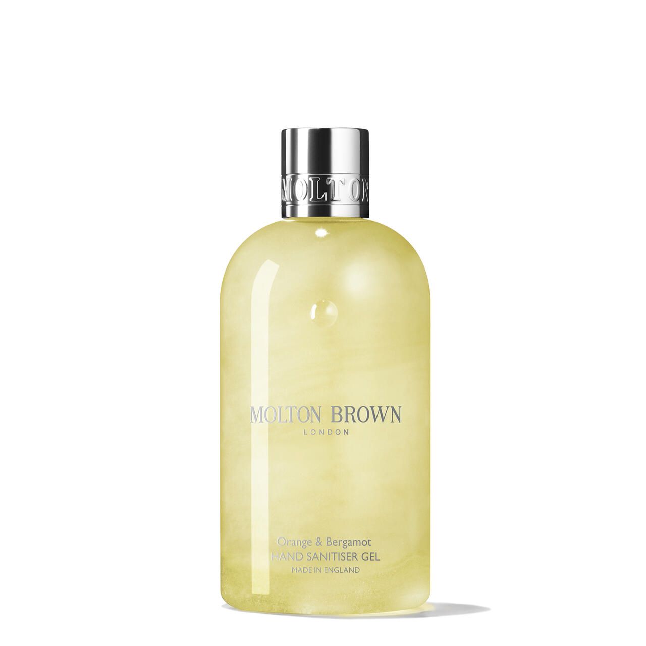 Gel-Handdesinfektionsmittel von Molton Brown. Gelbe Flüssigkeit in einer Flasche mit silbernem Deckel. Aufschrift: Orange & Bergamot.