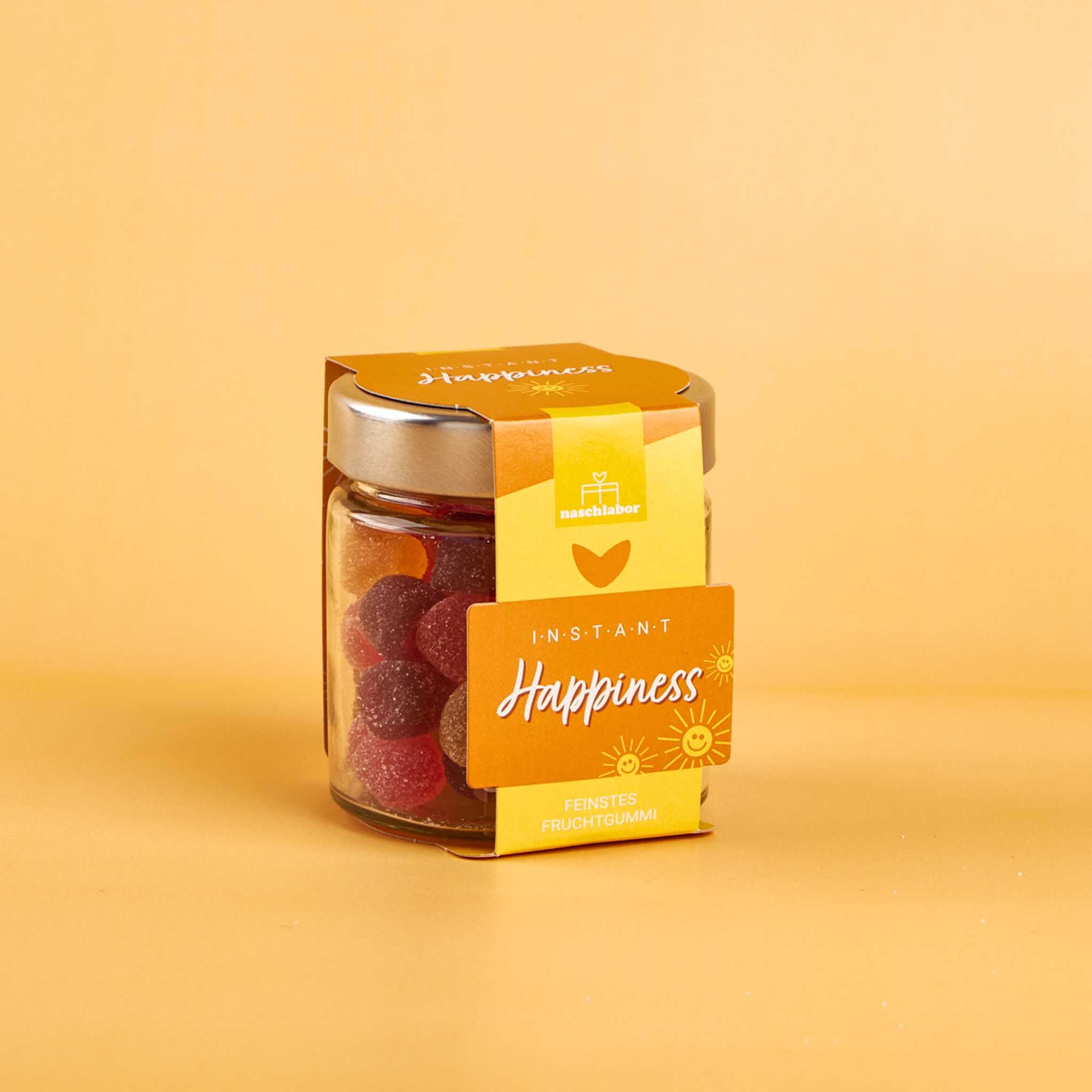Glas mit Fruchtgummi, Etikett mit "Instant Happiness".
