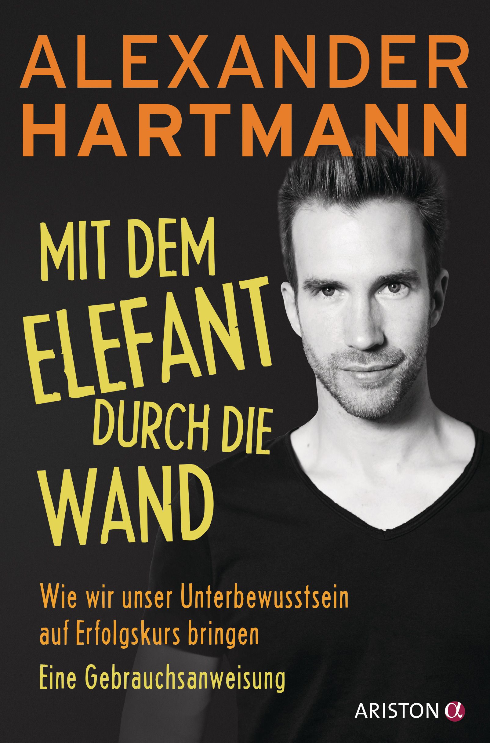 Buchcover: "Mit dem Elefant durch die Wand". Autor Alexander Hartmann. Schwarzer Hintergrund, Mann im Vordergrund.