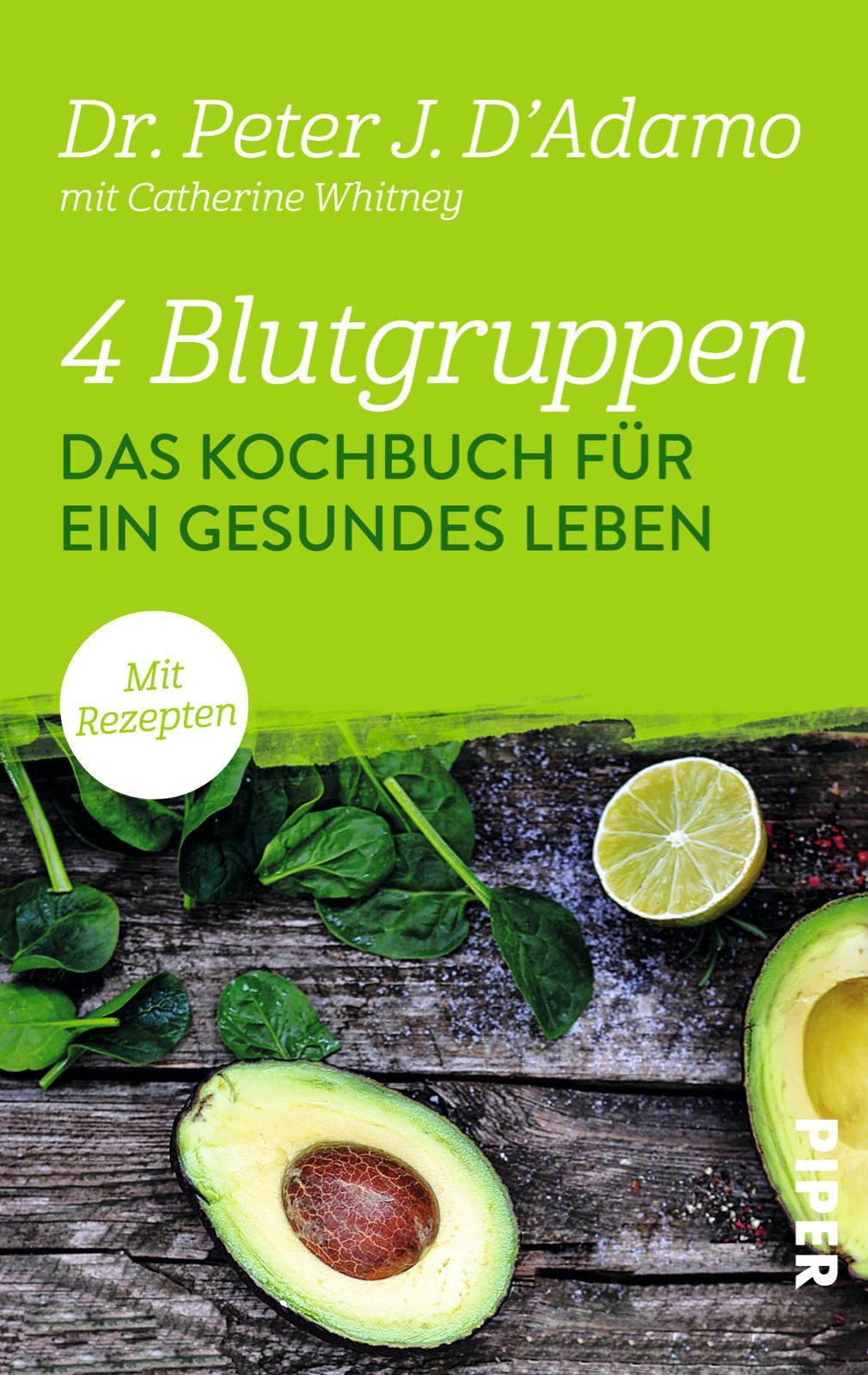 Buchcover: "4 Blutgruppen - Das Kochbuch für ein gesundes Leben". Autor: Dr. Peter J. D'Adamo. Mit Rezepten. Auf Holzbrett mit Avocado, Limette und Spinat.