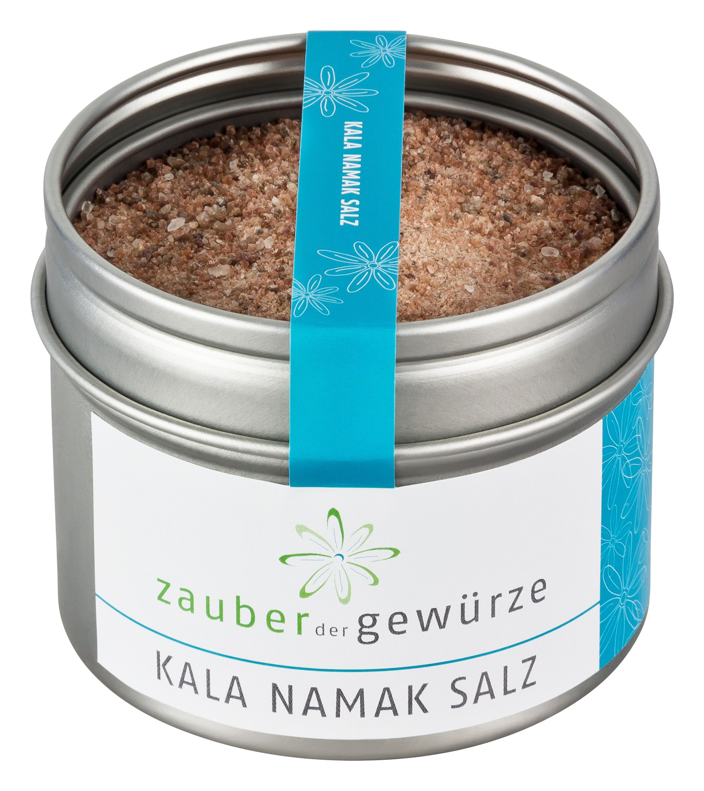 Runde Dose mit Salz. Türkisfarbenes Band mit Aufschrift 'Kala Namak Salz'. Aufschrift 'Zauber der Gewürze'.