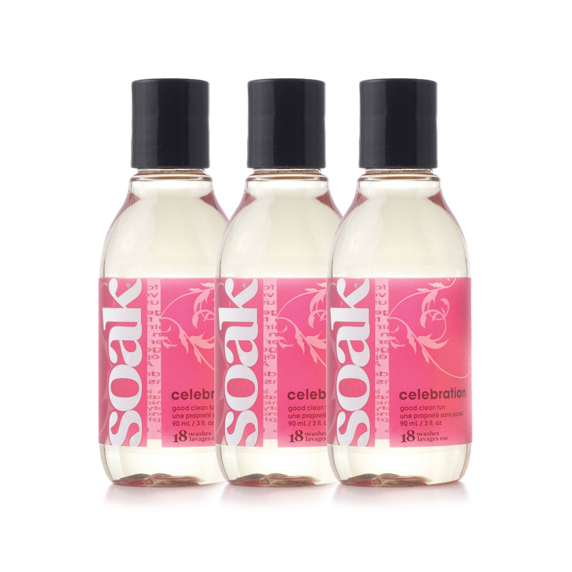 Drei klare Flaschen mit schwarzen Deckeln und rosa Etiketten. Aufschrift: Soak, Celebration, 50 ml.