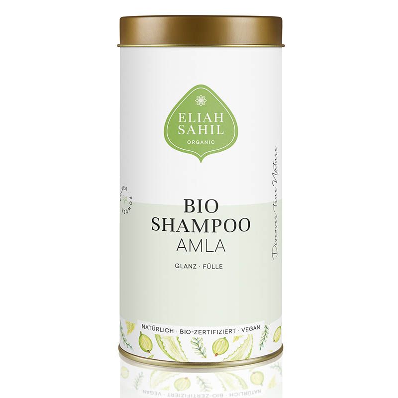 Zylindrische Dose mit Deckel. Aufschrift: Eliah Sahil Organic Bio Shampoo Amla. Grün-weißes Design. Vegan, bio-zertifiziert.