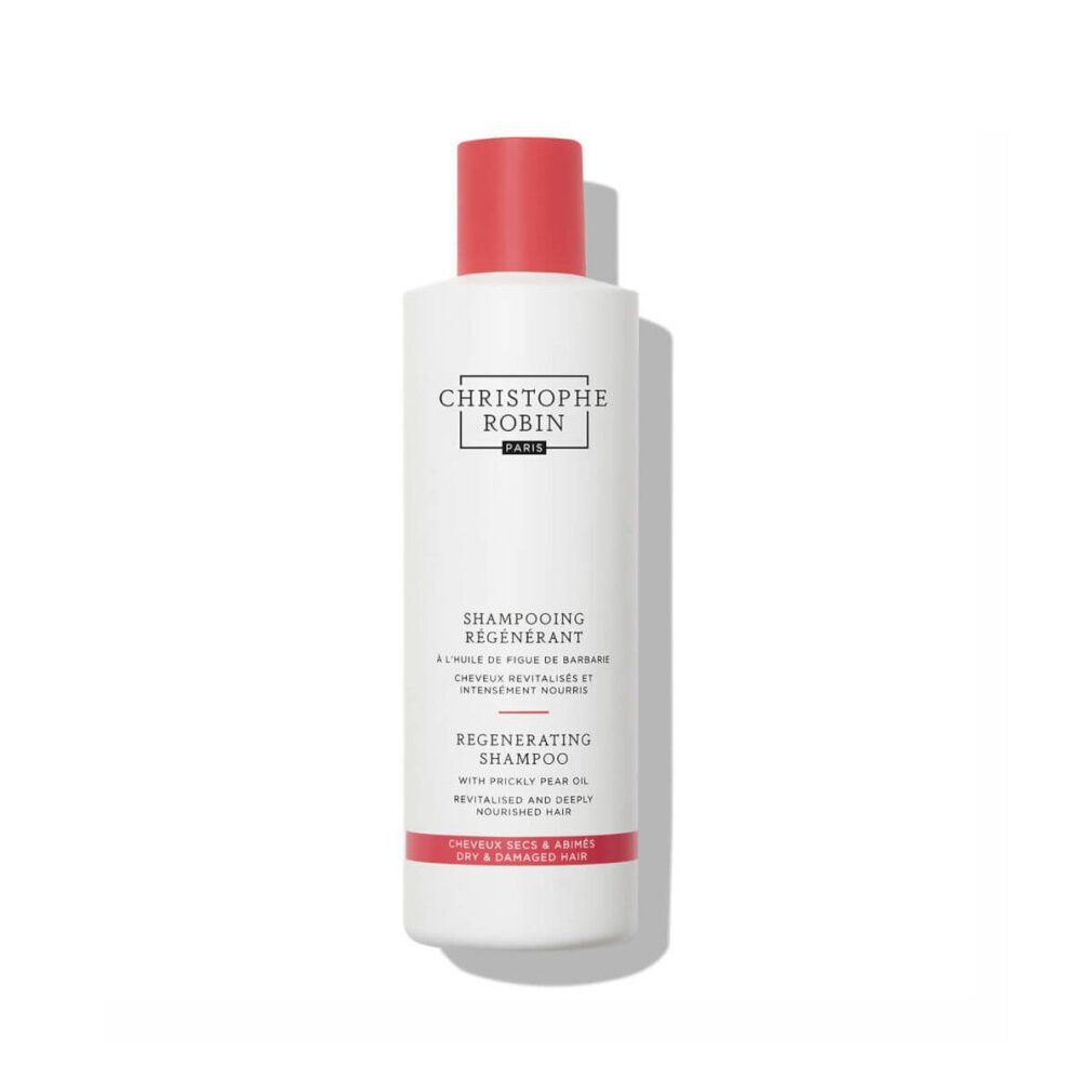 Weiße Flasche mit rotem Verschluss. Aufschrift: CHRISTOPHE ROBIN PARIS, SHAMPOOING REGENERANT, REGENERATING SHAMPOO.