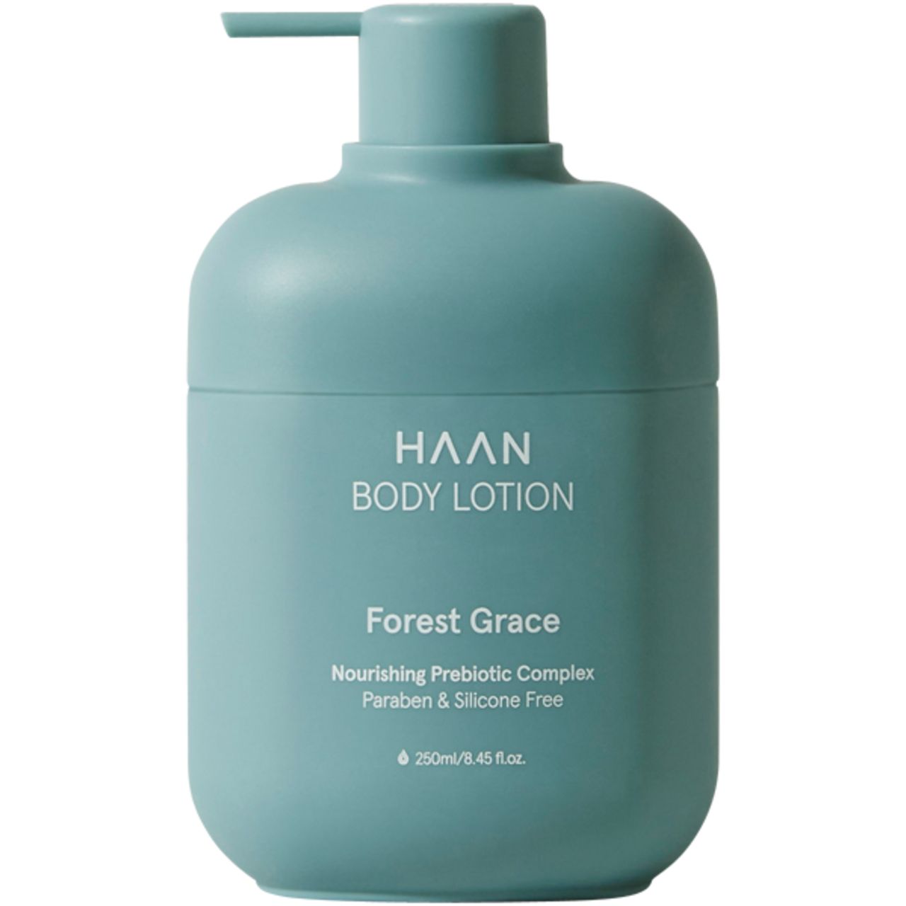 Türkisgrüne Körperlotion-Flasche mit Pumpe. Aufschrift: HAAN BODY LOTION, Forest Grace. Enthält Präbiotika. Ohne Parabene und Silikone.