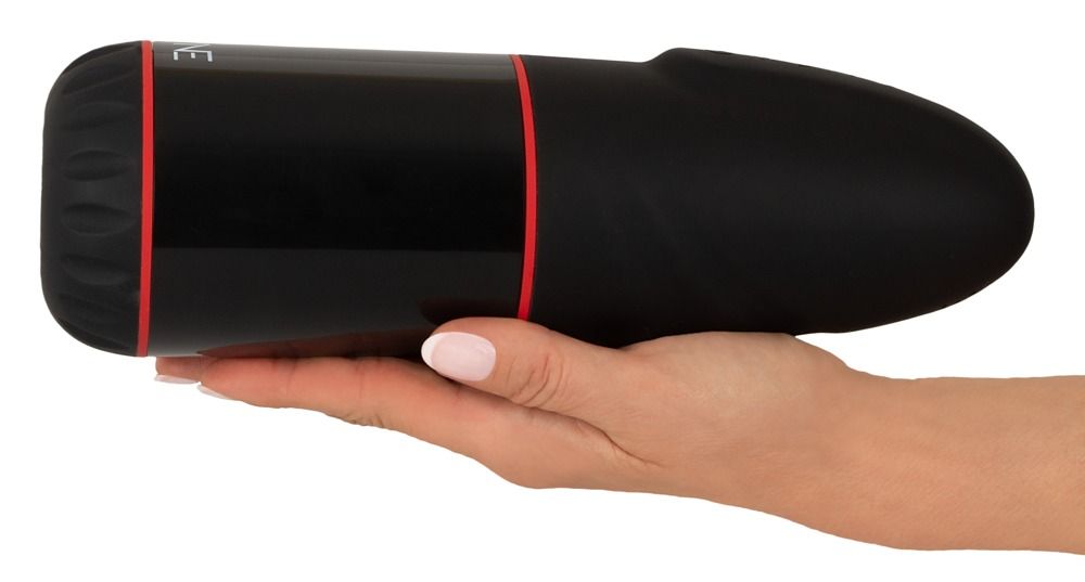 Schwarzes, zylindrisches Produkt mit rotem Akzent. In einer Hand gehalten.