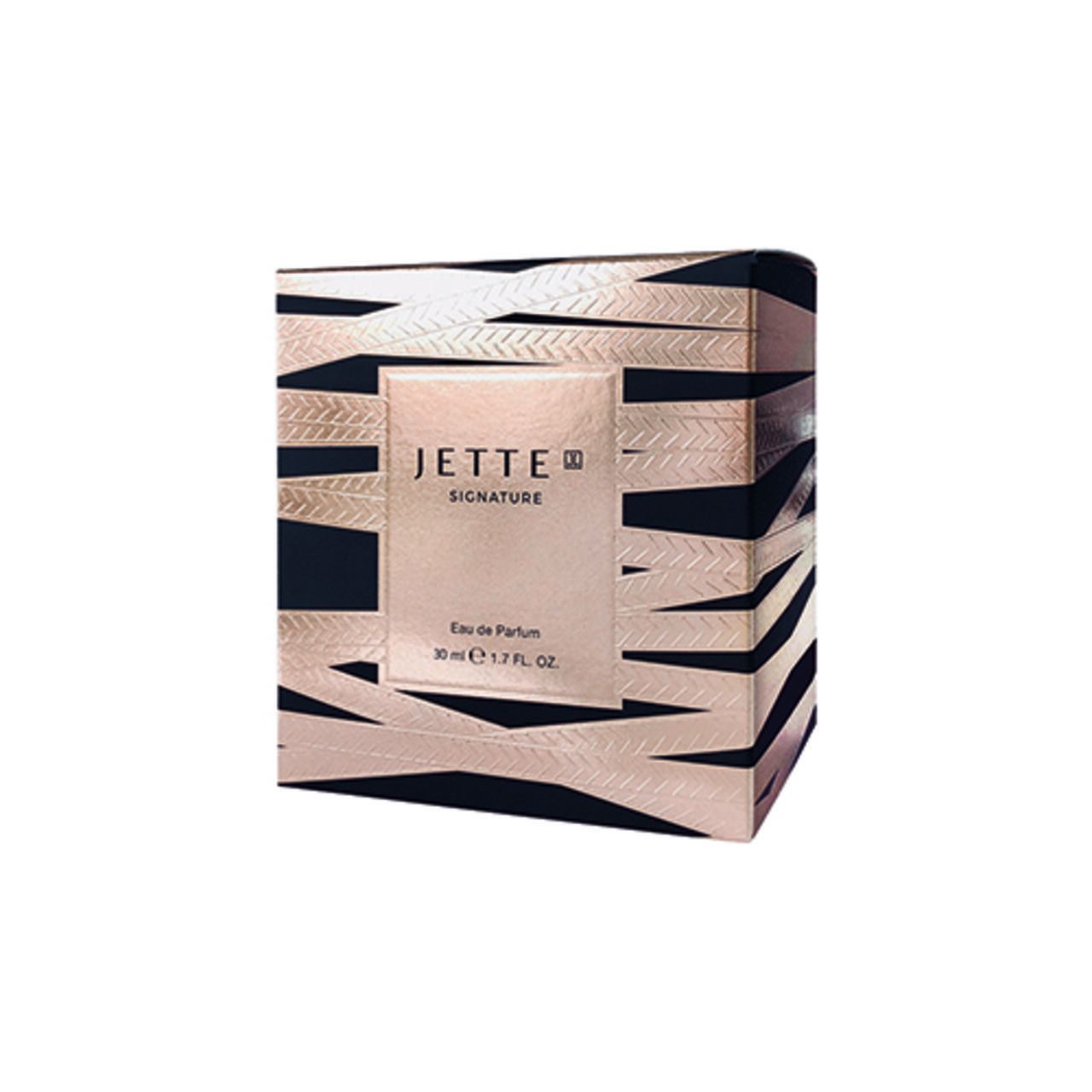 Quadratische Verpackung mit schwarz-goldenen Streifen. Aufschrift: Jette Signature. Eau de Parfum.