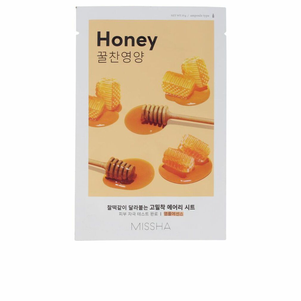 Gesichtsmaske mit Honig-Motiv. Verpackung mit Honigwaben und Honiglöffeln. Schriftzug "Honey" und "MISSHA".