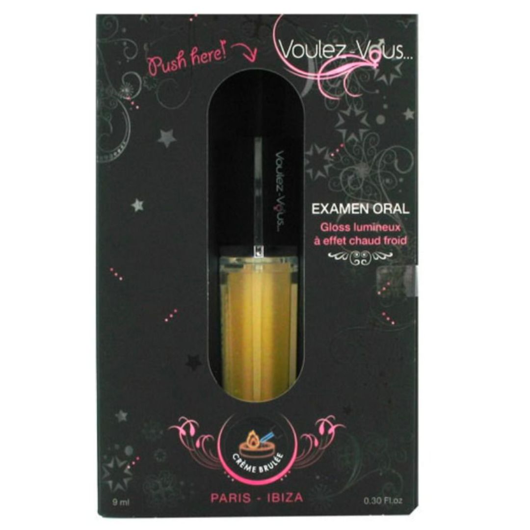 Lucidalabbra in confezione nera. Scritta: Voulez-Vous. Testo: Examen Oral. Gloss lumineux à effet chaud froid. Etichetta: Crème Brûlée.