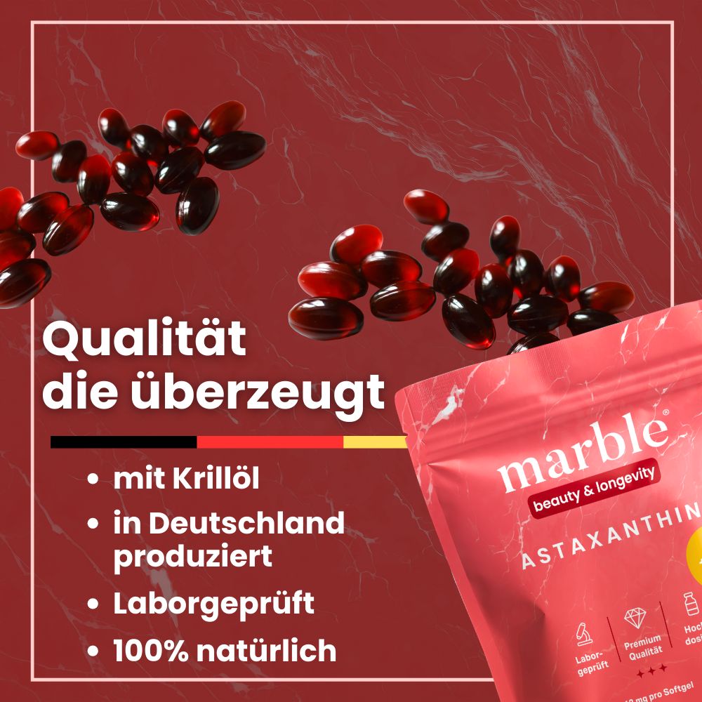 Astaxanthin-Kapseln und rosa Beutel. Text: marble, Astaxanthin, mit Krillöl, in Deutschland produziert, laborgeprüft, 100% natürlich.