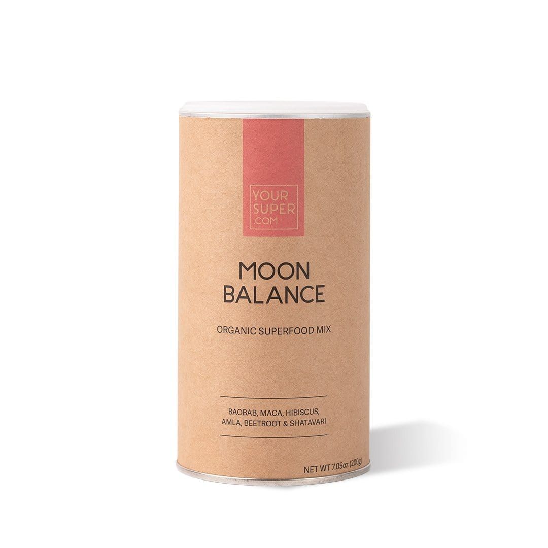 Zylindrische Dose mit "MOON BALANCE"-Aufdruck. Braune Verpackung mit rotem Streifen und weißem Deckel. "YOUR SUPER" Logo.