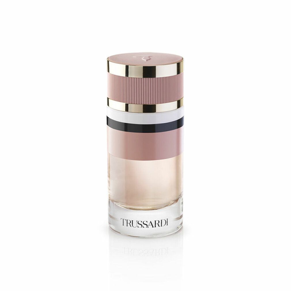 Trussardi Eau de Parfum Spray. Zylindrischer Flakon mit rosa, weißen und schwarzen Bändern. Aufschrift: Trussardi.