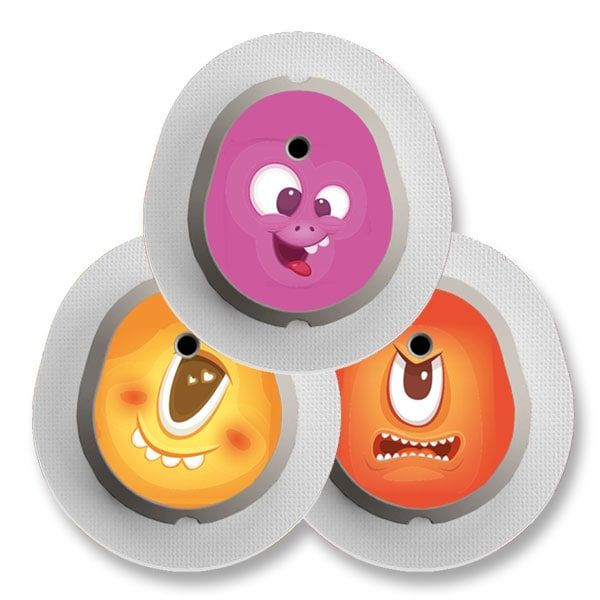 Drei runde Aufkleber mit Monstergesichtern. Rosa, orange und gelb. Grauer Rand und weißer Hintergrund.
