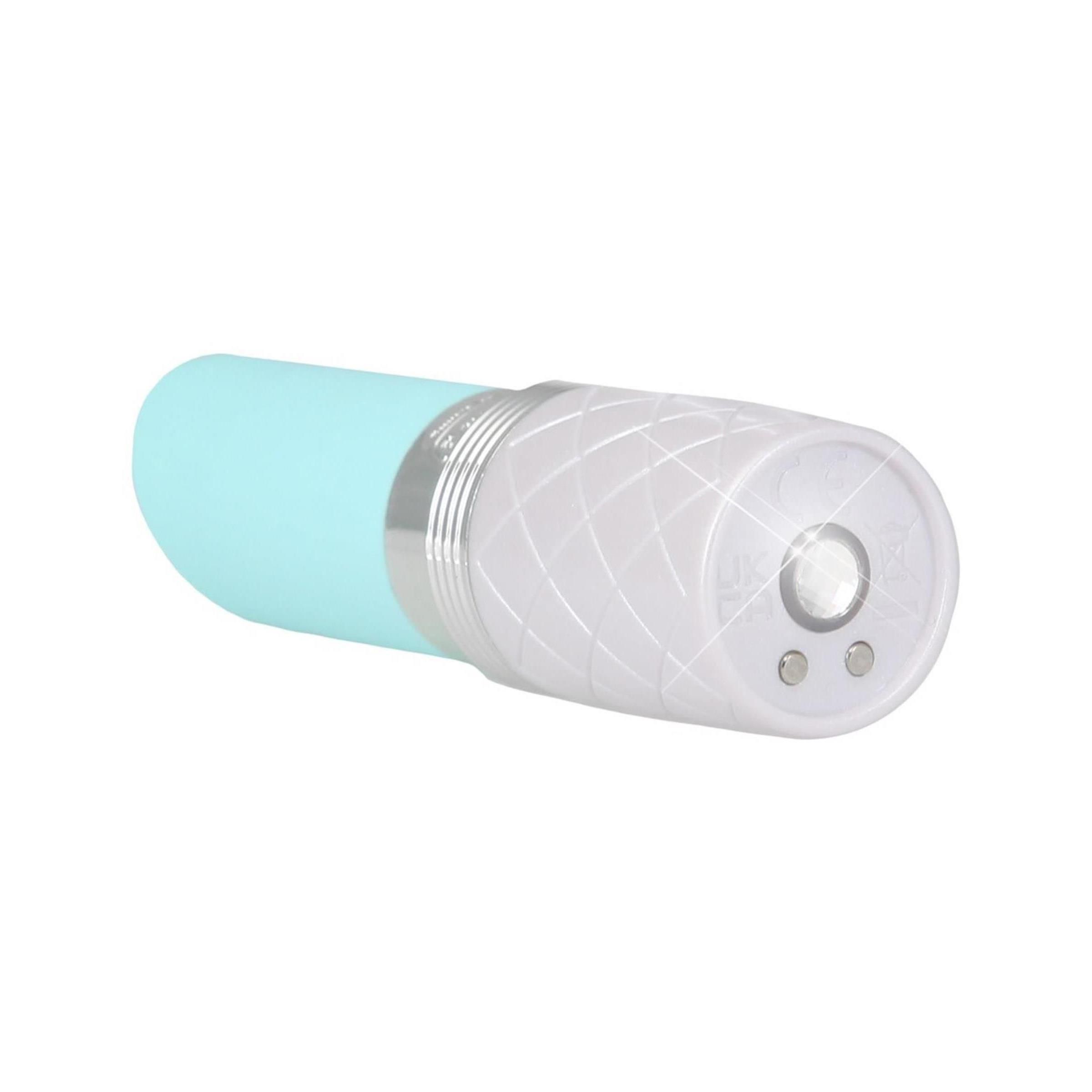 Weißes Gerät mit hellblauem Aufsatz und silbernen Akzenten. Das Gerät liegt.