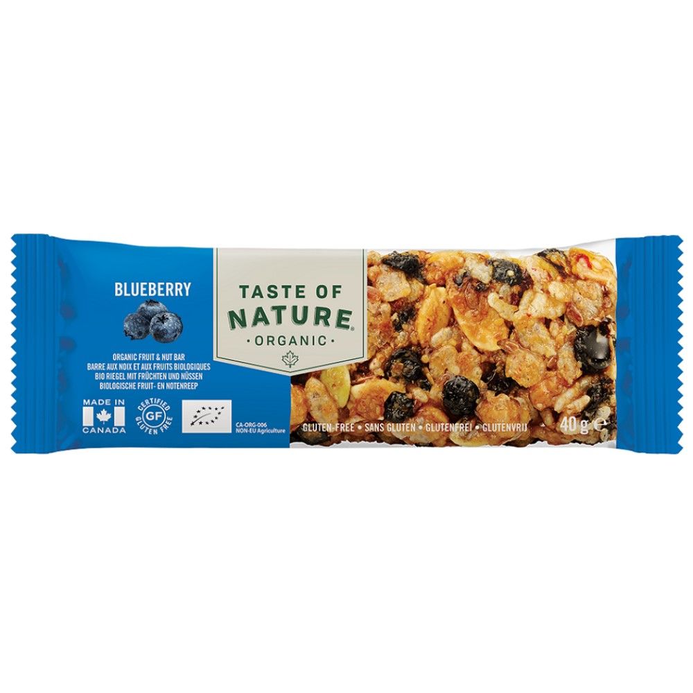 Ein einzelner "Taste of Nature" Bio-Frucht- und Nussriegel mit Blaubeeren. Die Verpackung ist blau und weiß mit dem Markennamen und dem Wort "Blaubeere" sowie dem Hinweis auf glutenfrei. Der Riegel selbst ist sichtbar und enthält Blaubeeren und Nüsse.