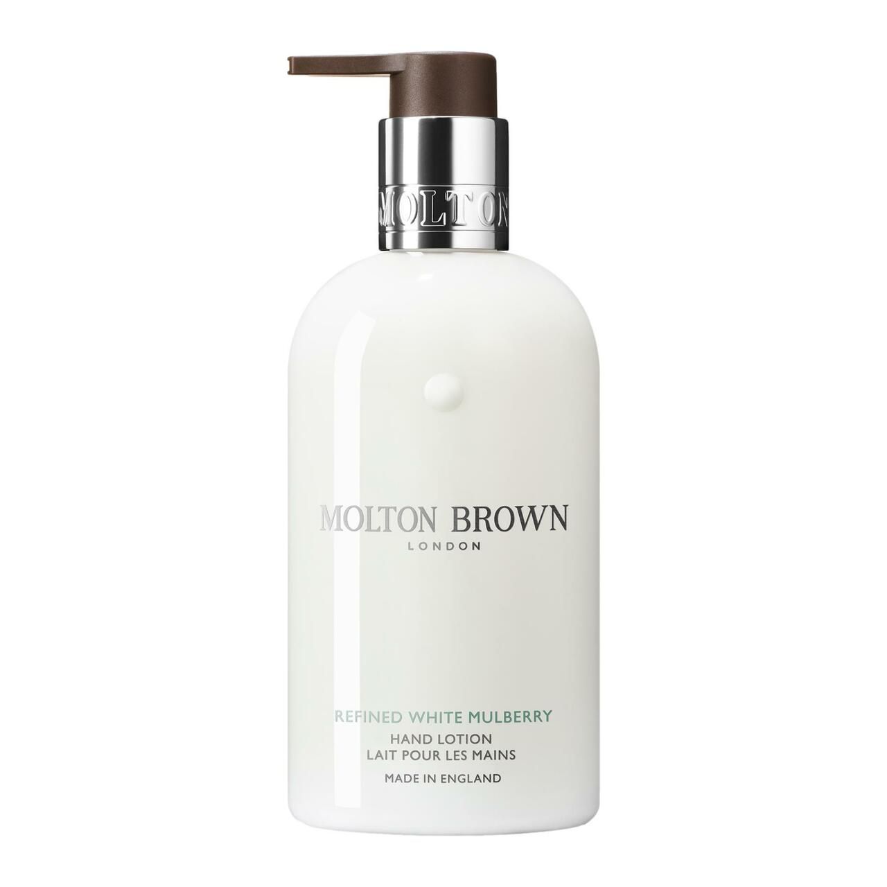 Weiße Handlotion-Flasche mit Pumpe. Aufschrift: Molton Brown, Refined White Mulberry Handlotion. Hergestellt in England.
