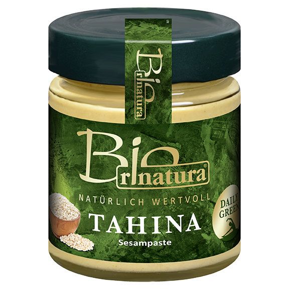 Glas mit Tahina Sesampaste. Grüner Deckel und Etikett mit Schriftzug "Bio" und "Tahina Sesampaste".