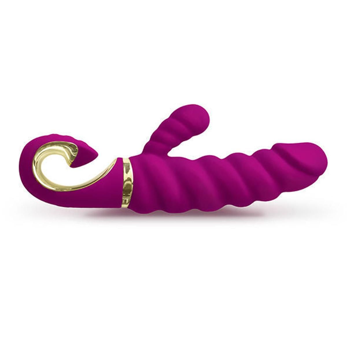 Lila Vibrator mit gewellter Oberfläche und gebogener Spitze. Goldfarbene Akzente. G-Punkt-Stimulator.