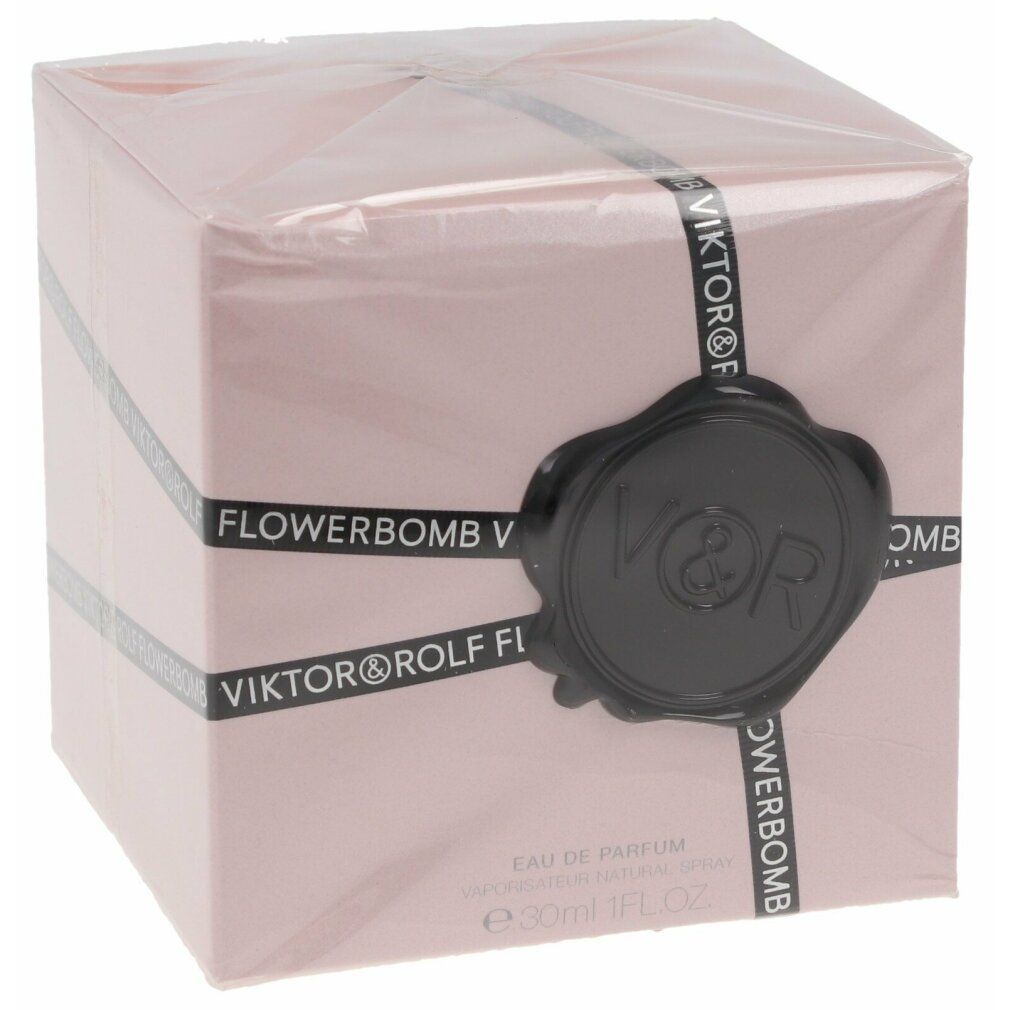 Rosa Verpackung für Flowerbomb von Viktor & Rolf. Schwarzes Band mit Text: Viktor & Rolf Flowerbomb. Schwarzes Siegel.