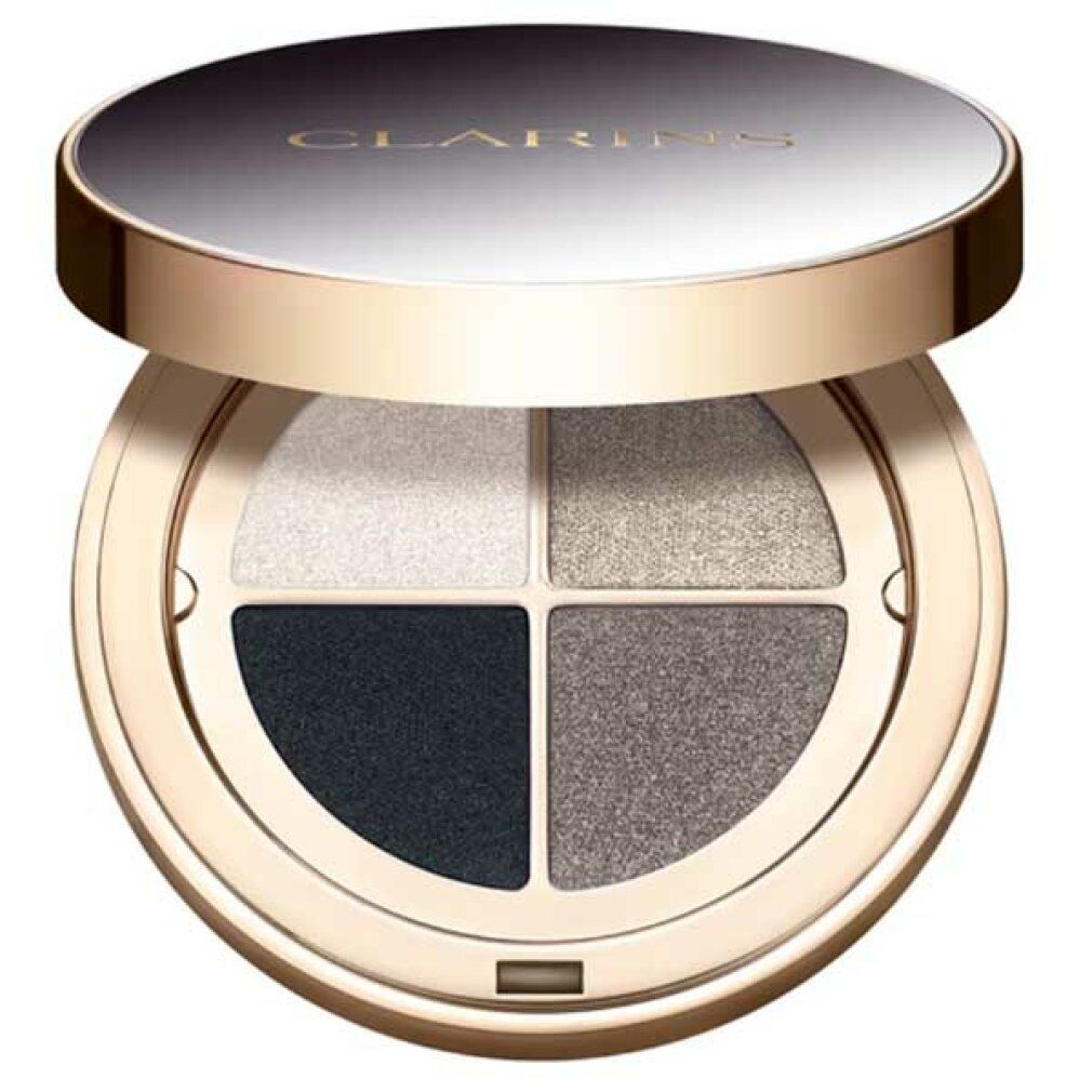 Runde Lidschatten-Palette mit vier Farben. Deckel geöffnet. Farben: Weiß, Grau, Dunkelgrau und Schwarz. Goldfarbener Rahmen.