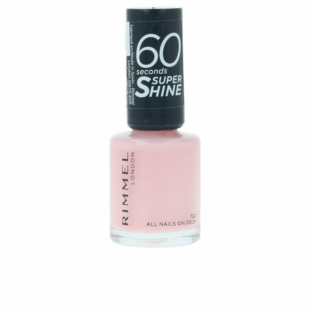 Nagellackflasche mit rosa Inhalt. Schwarzer Deckel mit weißer Aufschrift: 60 seconds Super Shine. Aufschrift: Rimmel London.
