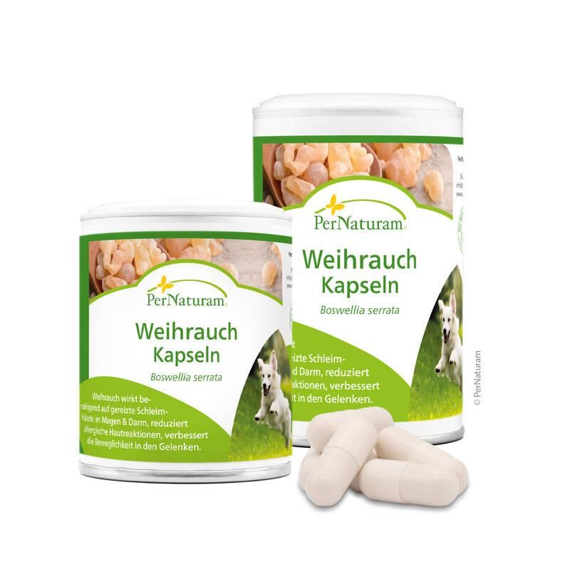 Zwei Dosen mit Kapseln, Produktname und Hund. Einige Kapseln liegen daneben.
