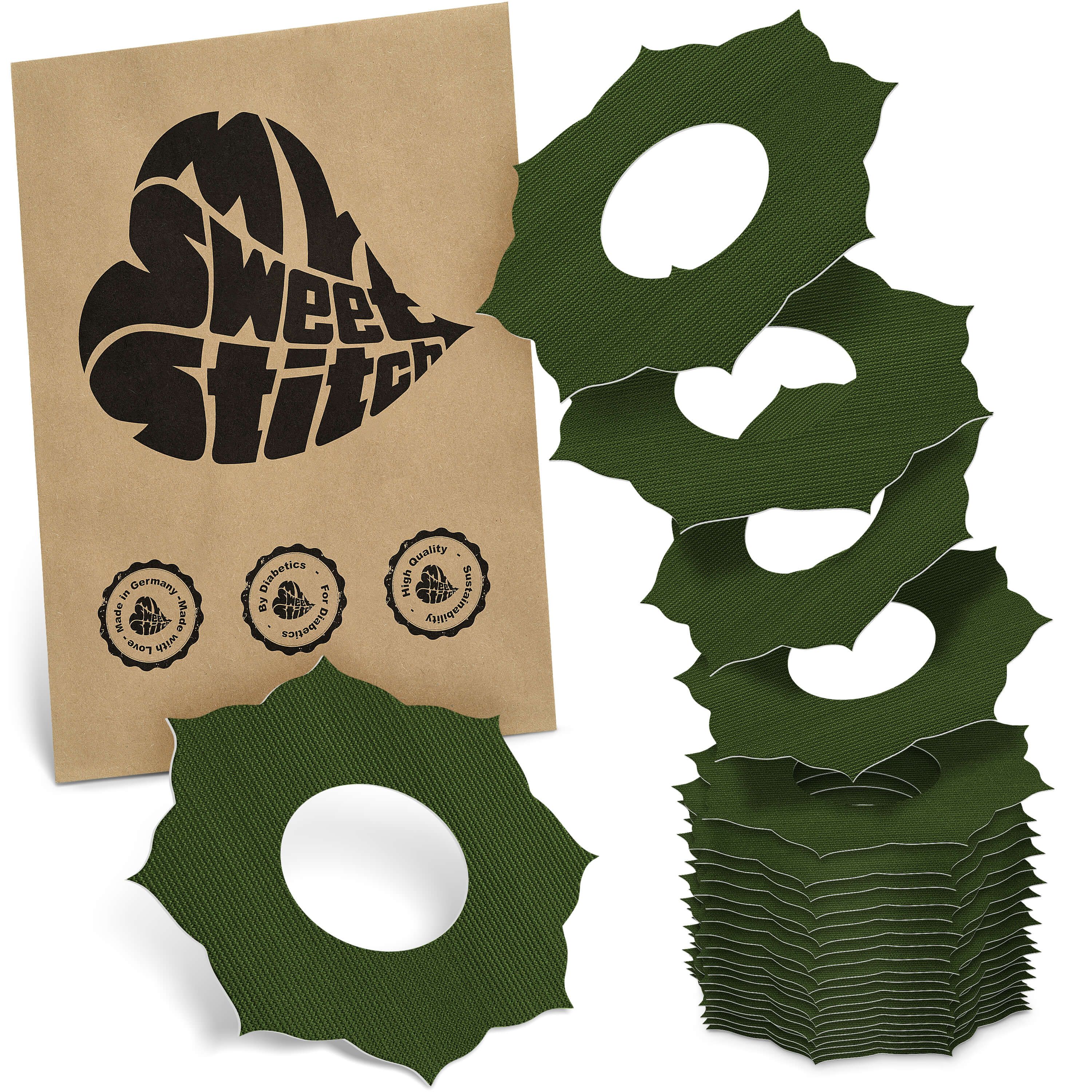 Grüne Ringpflaster mit Mandalamuster und Loch in der Mitte. Braune Verpackung mit Logo und Siegeln.